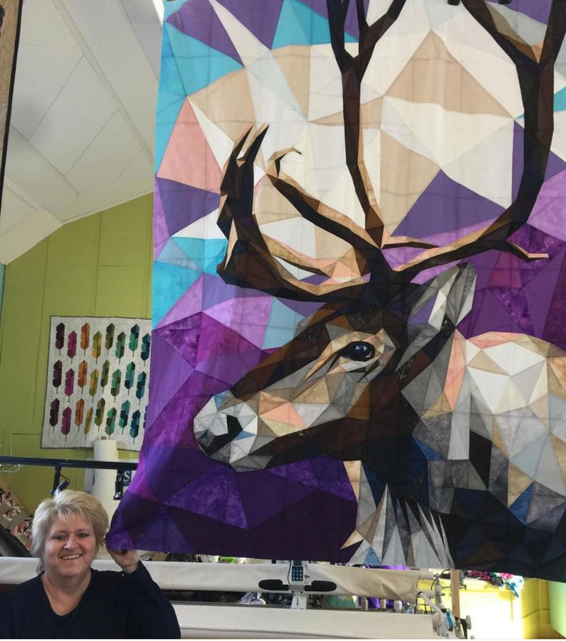 Picture of a quilter next to Legit Caribou